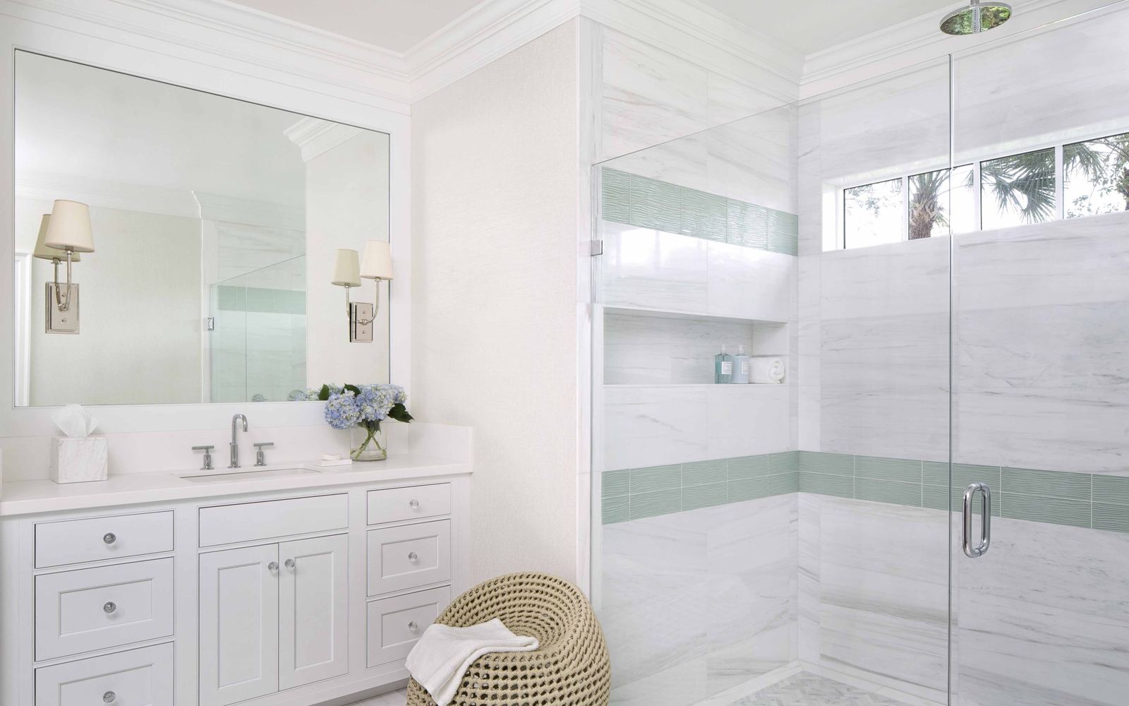 Elegant white bathroom with marble finishes in a Moorings home